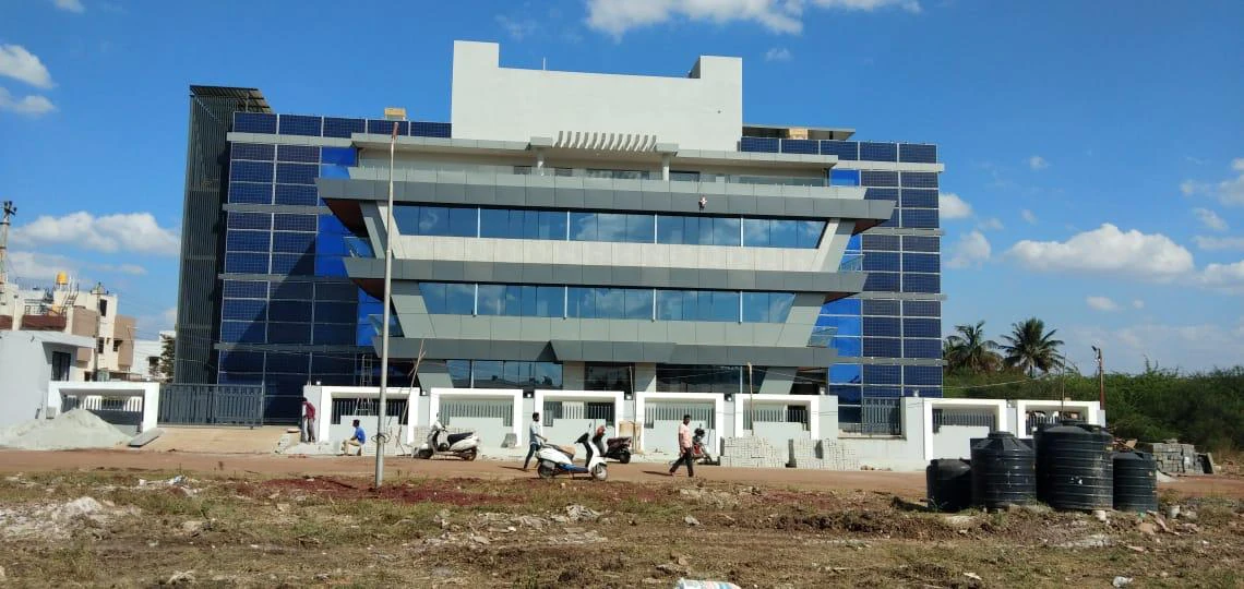 Commercial building with building-integrated photovoltaic panels across the facade
