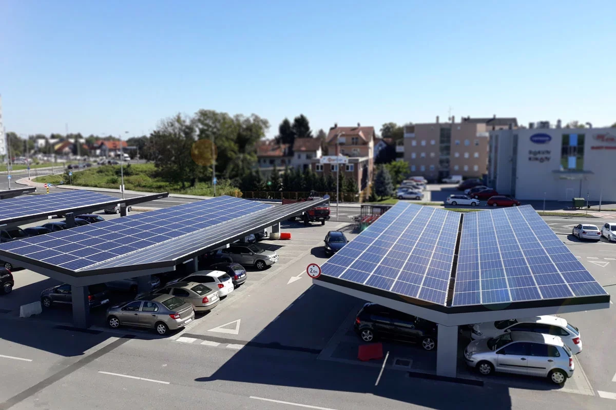 Solar carport structures over a parking area